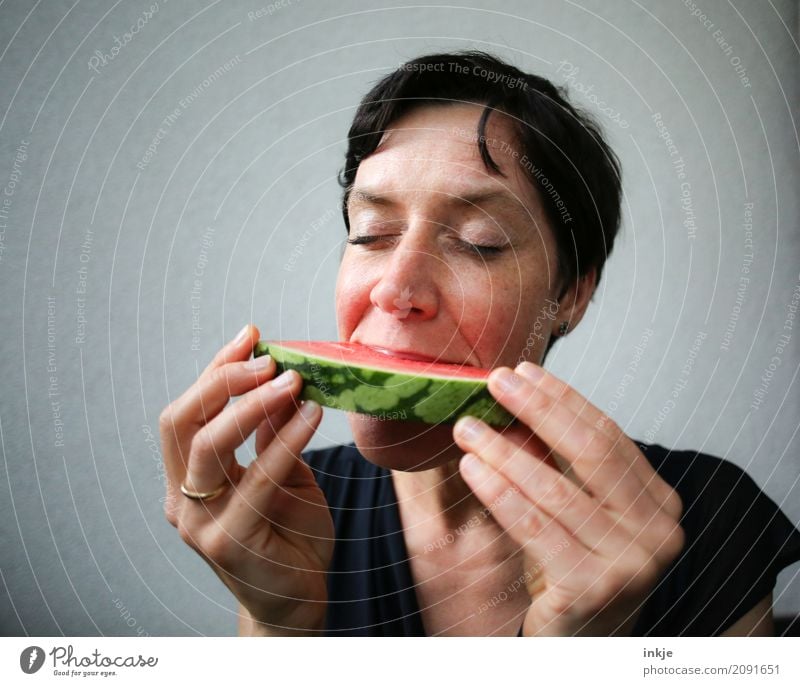 happy caucasian woman closes eyes in front of her watermelon Fruit Melon Water melon Part Nutrition Eating Organic produce Vegetarian diet Diet Slow food