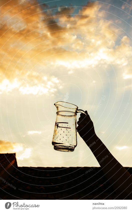 Hand holding a glass jar with an amazing sky as background Glass Lifestyle Elegant Style Design Drinking Human being Youth (Young adults) 1 18 - 30 years Adults