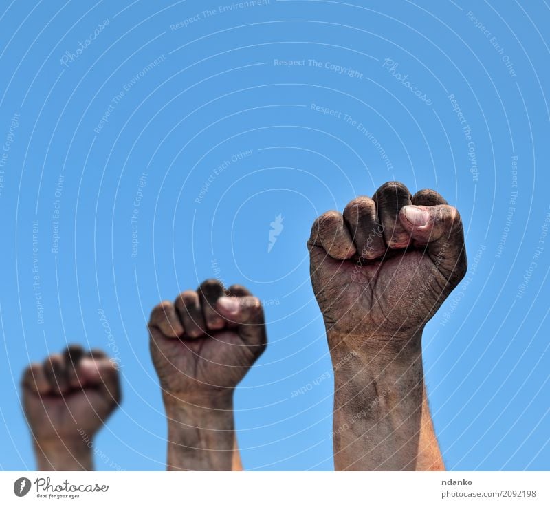 Three dirty male fists raised up Freedom Man Adults Hand Fingers Sky Old Aggression Dirty Strong Blue Black Optimism Power Protection Might Age aggressive