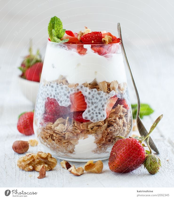 Chia pudding Strawberry parfait with greek yogurt and nuts Yoghurt Fruit Dessert Breakfast Diet Glass Spoon Green Red White Berries Cereal chia Pudding seed