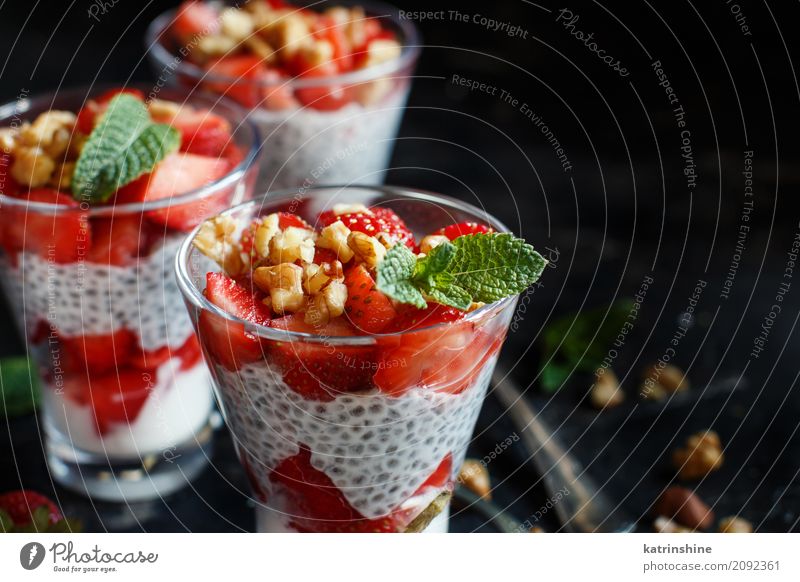 Chia pudding Strawberry parfait with greek yogurt and nuts Yoghurt Fruit Dessert Breakfast Diet Glass Spoon Red White Berries Cereal chia Pudding seed Dairy