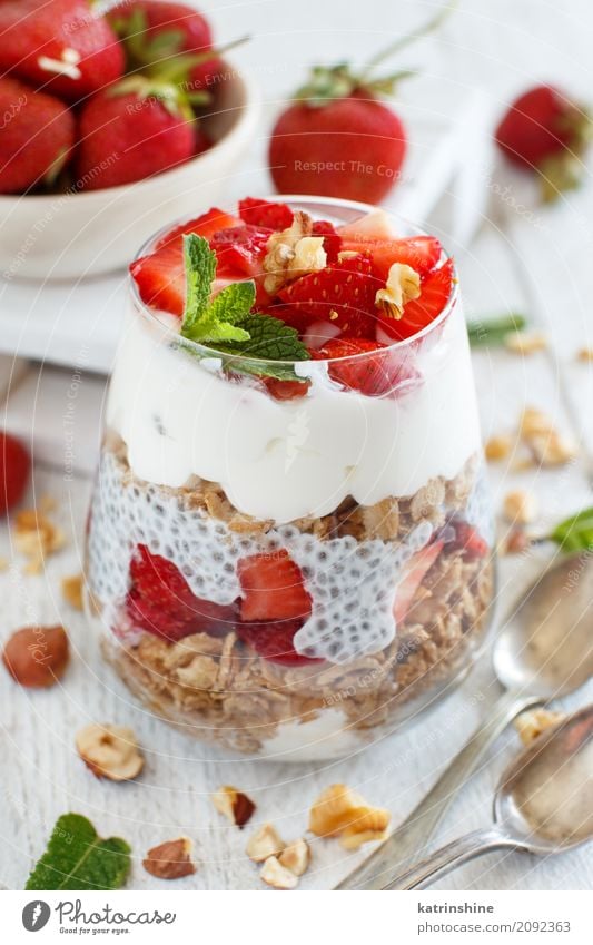 Chia pudding Strawberry parfait with greek yogurt and nuts Yoghurt Fruit Dessert Eating Breakfast Diet Bowl Spoon Red White Berries Cereal chia Pudding seed