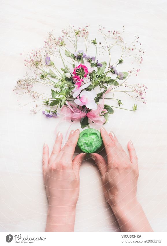 Female hands hold handmade green soap Style Beautiful Personal hygiene Cosmetics Healthy Spa Feminine Woman Adults Hand Plant Flower Design Aromatic Self-made