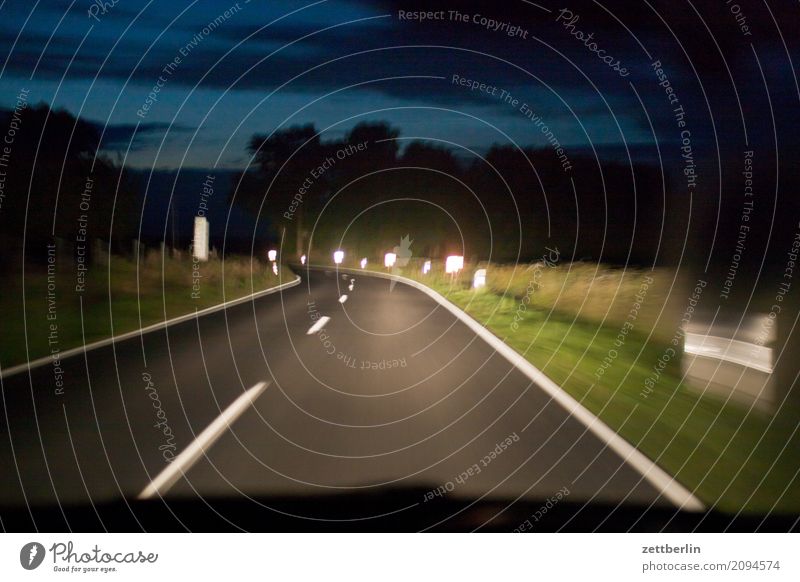 high beam Evening Car Highway Driving Vacation & Travel Movement Line Direct journey home Curve Country road Night Reflector Reflection Travel photography Speed