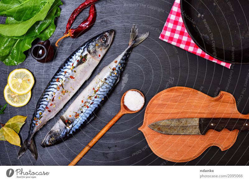 Fresh mackerel fish with spice Seafood Herbs and spices Nutrition Lunch Dinner Diet Pan Spoon Ocean Table Restaurant Gastronomy Nature Animal Wood Natural Green