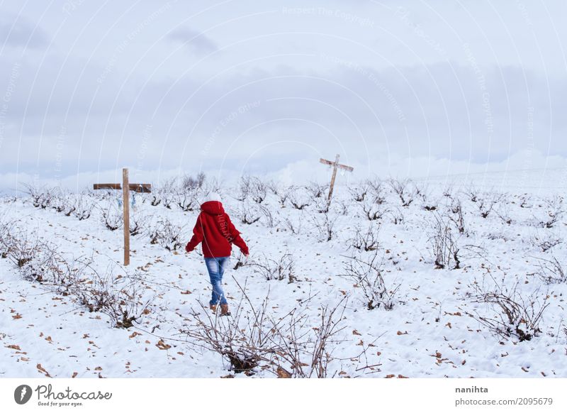 Someone walking in a snowy field with crosses Human being Androgynous Youth (Young adults) 1 18 - 30 years Adults Environment Nature Landscape Sky Clouds Winter