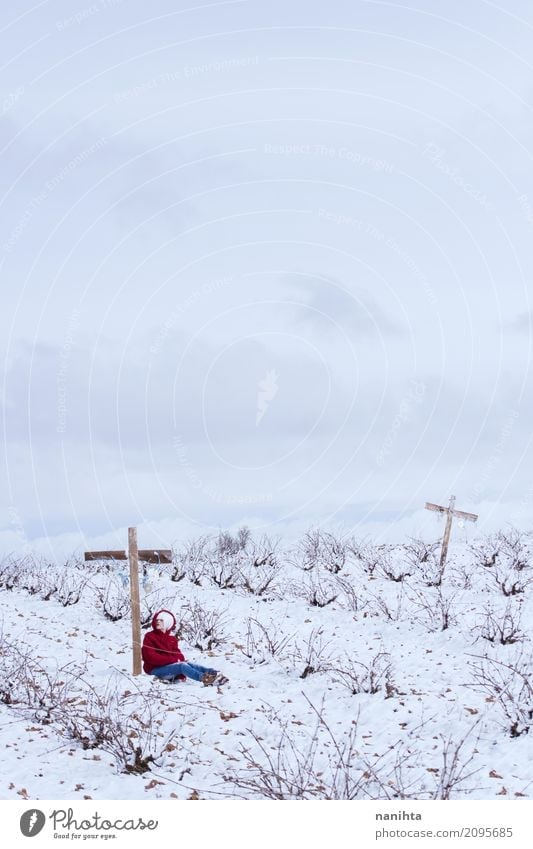 One person leaning on a cross in a snowy field Human being Feminine Young woman Youth (Young adults) 1 18 - 30 years Adults Environment Nature Landscape Sky