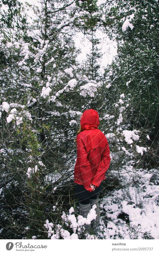 Mysterious woman lost in a snowy forest Lifestyle Winter Snow Winter vacation Human being Feminine Young man Youth (Young adults) 1 Environment Nature Snowfall