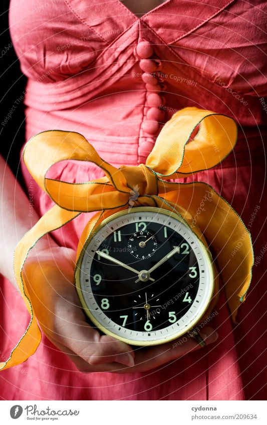for you Lifestyle Contentment Human being Woman Adults Hand Accuracy Idea Planning Transience Time Alarm clock Clock Bow Gift Colour photo Close-up Detail Day