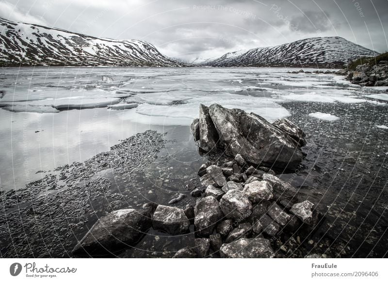 norge V Nature Landscape Water Storm clouds Spring Winter Mountain Glacier Lake Norway Scandinavia Jotunheimen Dark Gigantic Cold Brown Gray Snow Ice Ice floe
