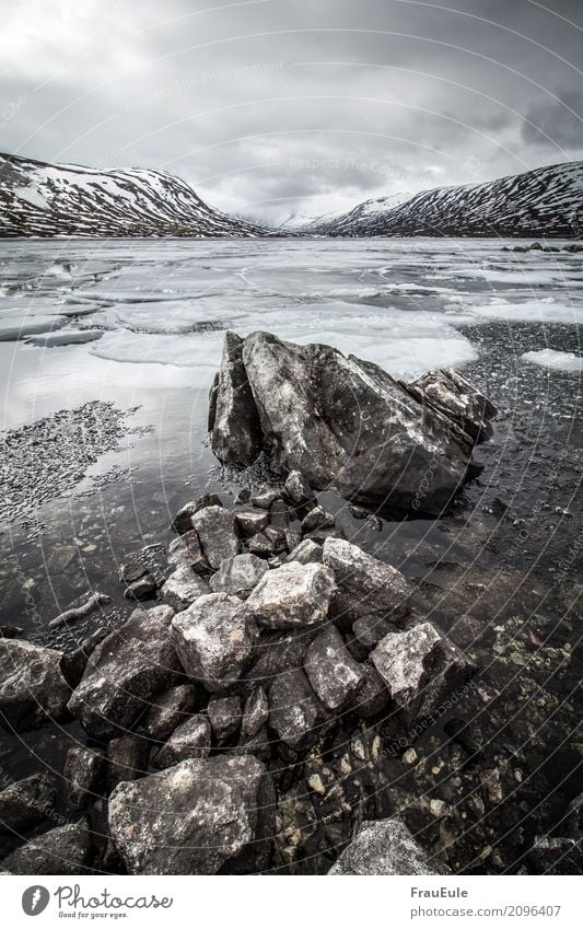 norge IV Nature Landscape Water Storm clouds Spring Winter Mountain Glacier Lake Norway Scandinavia Jotunheimen Deserted Dark Fluid Cold Wet Brown Gray Ice