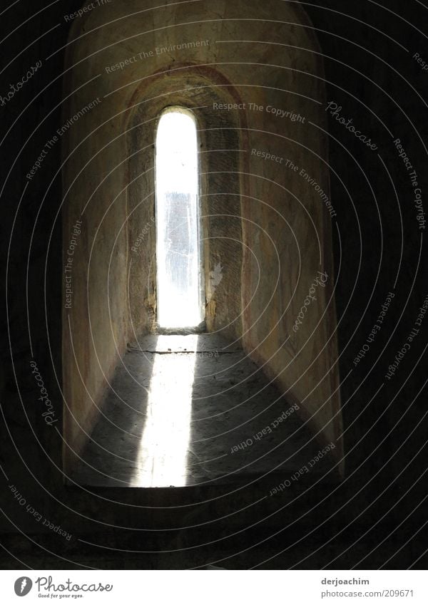 A chapel window into which a ray of sunlight comes in. With light and shadow Regensburg Church Manmade structures Wall (barrier) Wall (building) Window Stone