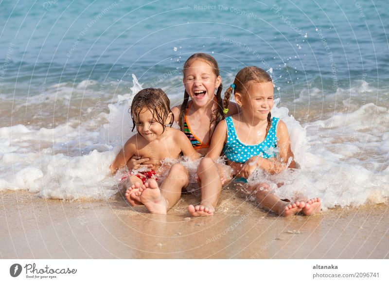 Two sisters and brother playing on the beach Lifestyle Joy Happy Beautiful Relaxation Leisure and hobbies Playing Vacation & Travel Freedom Summer Sun Beach