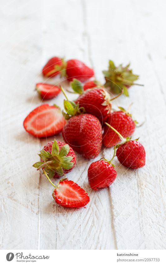 Strawberries whole and cut on a white wooden table Fruit Dessert Diet Summer Table Wood Fresh Bright Delicious Natural Juicy Red White Colour Berries colorful