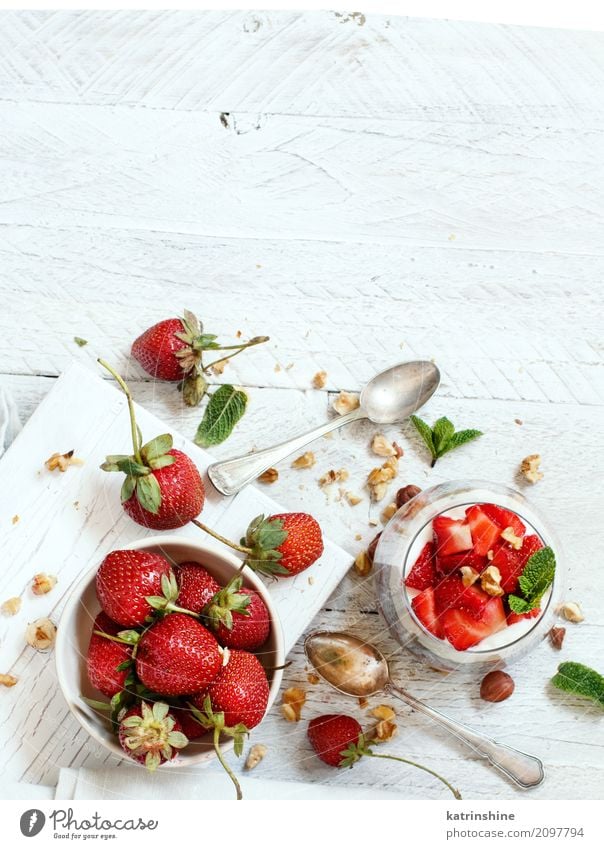 Chia pudding Strawberry parfait with greek yogurt and nuts Yoghurt Fruit Dessert Eating Breakfast Diet Bowl Spoon Red White Berries Cereal chia Pudding seed