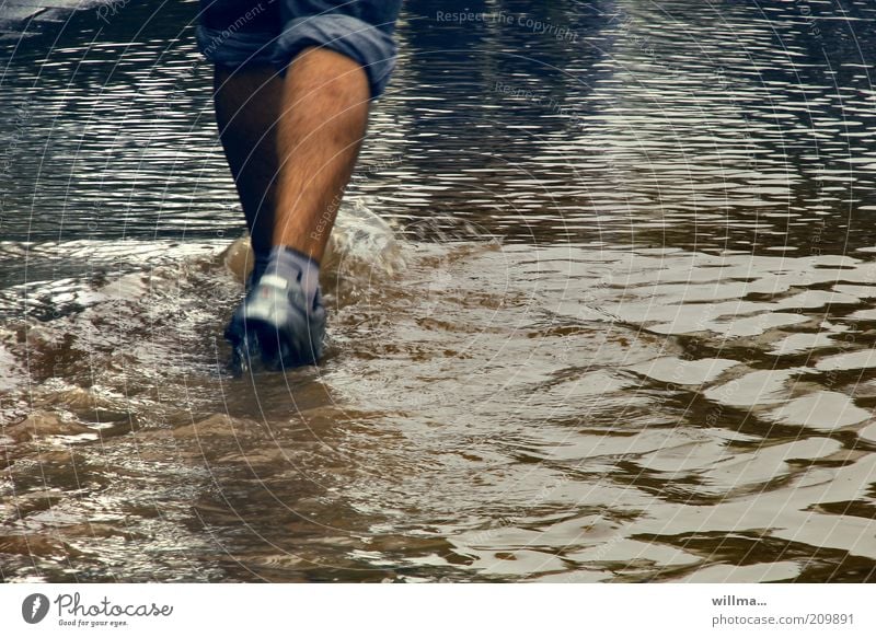 high water Flood Deluge Human being Legs Feet Pedestrian Storm Footwear Going Walking wade Water level Torrents of water Calf Wet Elements