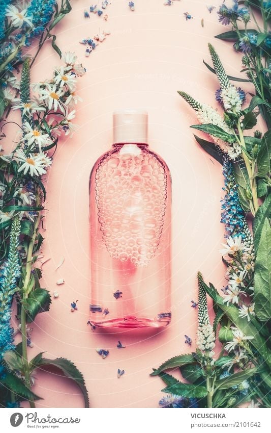 Nature cosmetics bottle with plant and flowers Lifestyle Shopping Style Beautiful Personal hygiene Cosmetics Perfume Healthy Spa Massage Plant Rose Pink Design