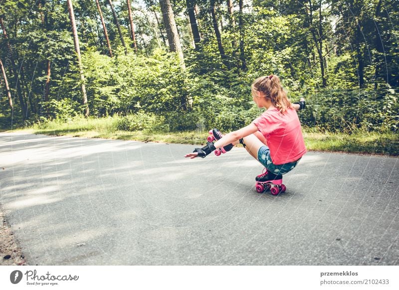 Young girl roller skating down on a forest road Lifestyle Joy Happy Relaxation Vacation & Travel Freedom Summer Sports Child Human being Girl