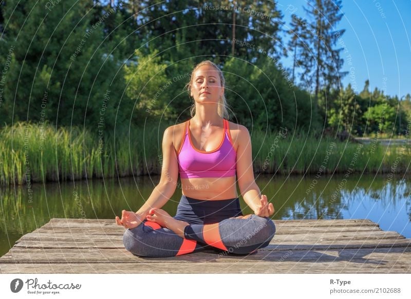 A sporty woman doing yoga and stretching exercises Lifestyle Wellness Sports Yoga Human being Woman Adults Nature Park Fashion Blonde Fitness aerobics active