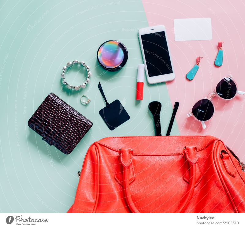 Flat lay of woman bag Lifestyle Elegant Style Design Skin Make-up Lipstick Vacation & Travel Telephone PDA Technology Feminine Woman Adults Fashion Leather