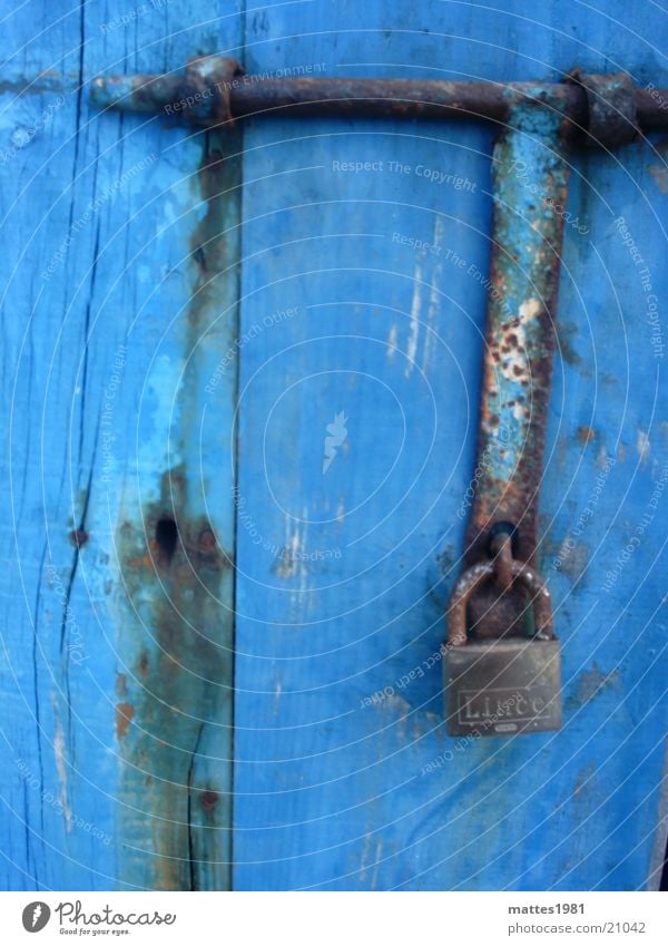 hang out Padlock Safety Bombproof Closed Defensive Archaic Things Rust Old Blue Wooden door Shabby Weathered Cobalt blue Protection