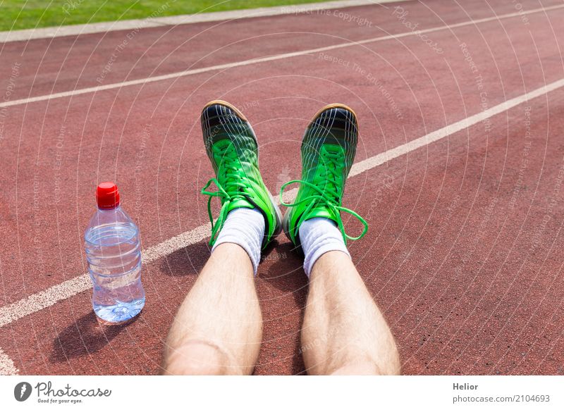 Athlete with green racing shoes and water bottle Bottle Sports Sportsperson Jogging Racecourse Human being Masculine Man Adults Legs Feet 1 30 - 45 years