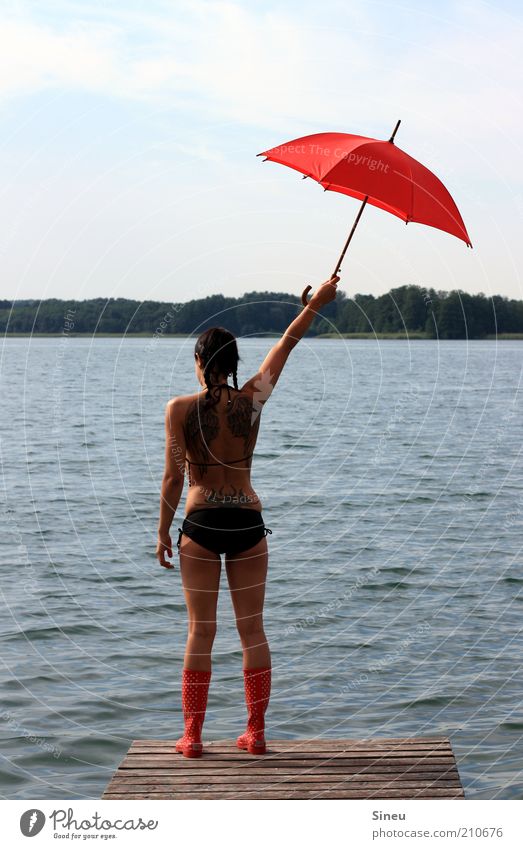 Over here! Vacation & Travel Tourism Summer vacation Woman Adults 1 Human being Sky Beautiful weather Lake Deserted Bikini Rubber boots Umbrella Observe Stand