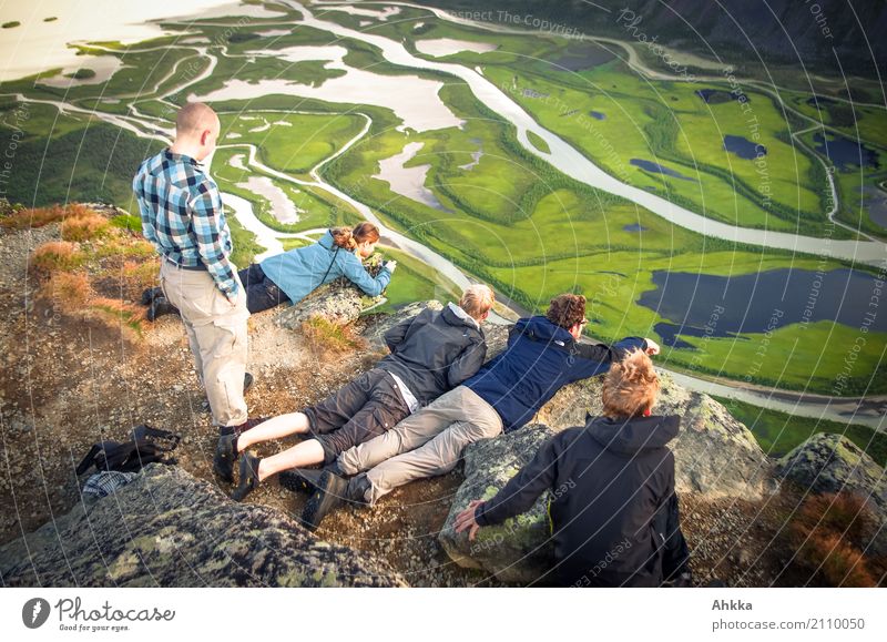 Group of young people looking at a natural spectacle in Sarek Vacation & Travel Trip Adventure Far-off places Mountain Hiking Education Adult Education School