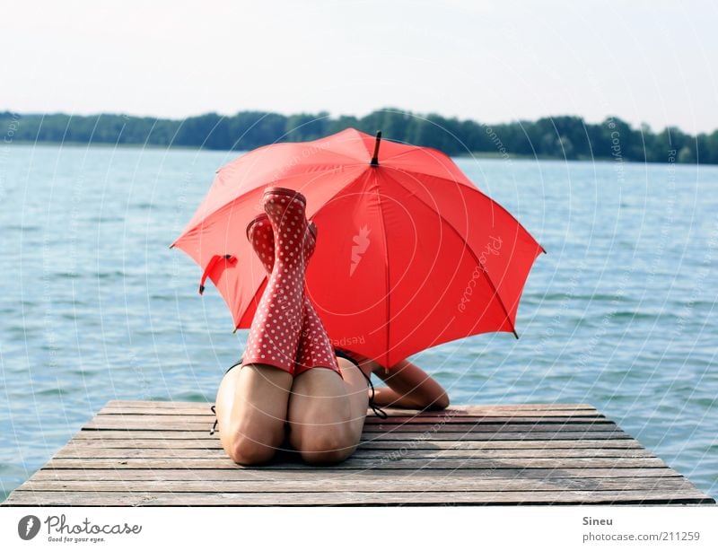 OK, I'll wait... I Woman Adults Lie Tourism Far-off places Summer vacation Feminine Sky Beautiful weather Lake Bikini Umbrella Rubber boots Observe Discover
