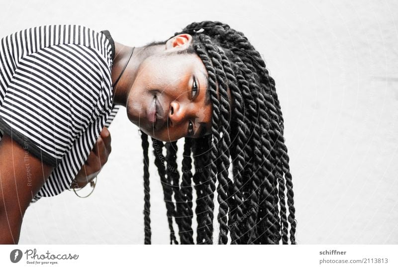Young dark skinned woman with dreadlocks looks at the camera Human being Feminine Young woman Youth (Young adults) Woman Adults Head Hair and hairstyles