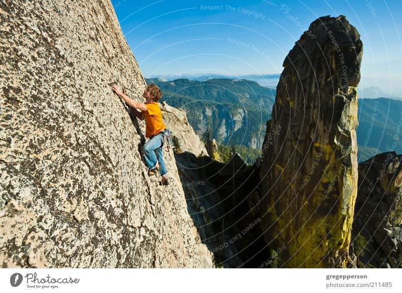 Rock climber reaching. Life Adventure Freedom Mountain Sports Fitness Sports Training Climbing Mountaineering Young man Youth (Young adults) 1 Human being