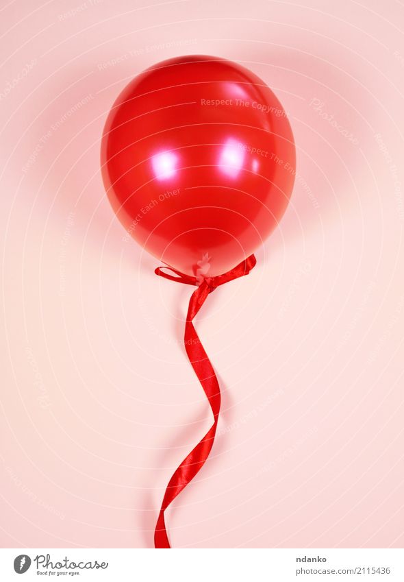 Red balloon on a red ribbon - a Royalty Free Stock Photo from Photocase