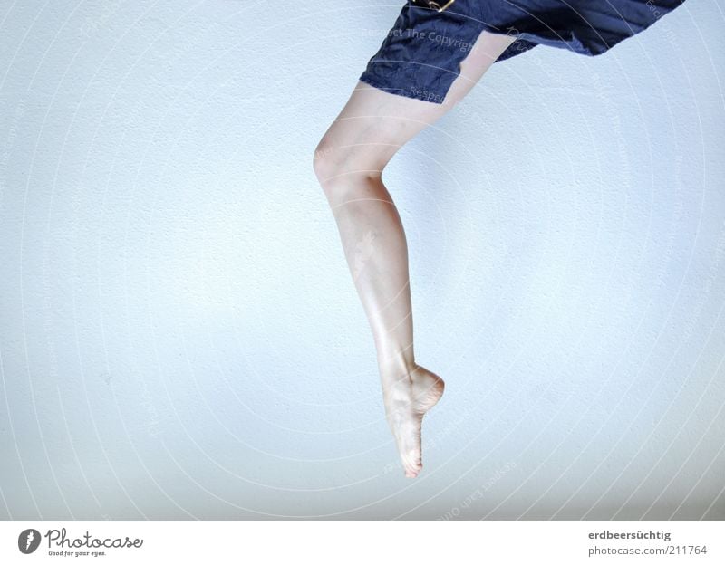 erratic - Half-naked woman's leg protrudes from the upper edge of the picture Elegant Skin Feminine Legs Feet Skirt Cloth Flying Jump Dance Esthetic Free Cold
