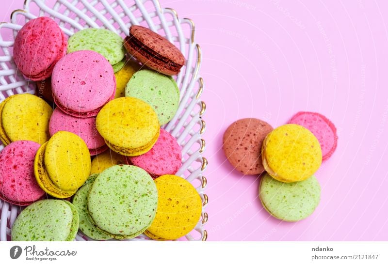 macarons multicolored Dessert Candy Plate Gastronomy Eating Bright Delicious Brown Yellow Green Pink Tradition Macaron colorful background sweet cake