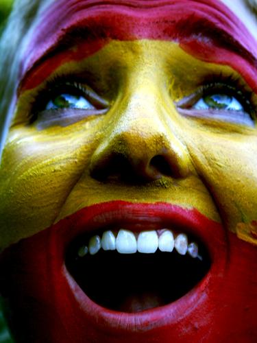 Spain Young woman Youth (Young adults) Face Scream Yellow Red Colour photo Exterior shot Day Portrait photograph Facial painting Teeth Enthusiasm Joy Fan