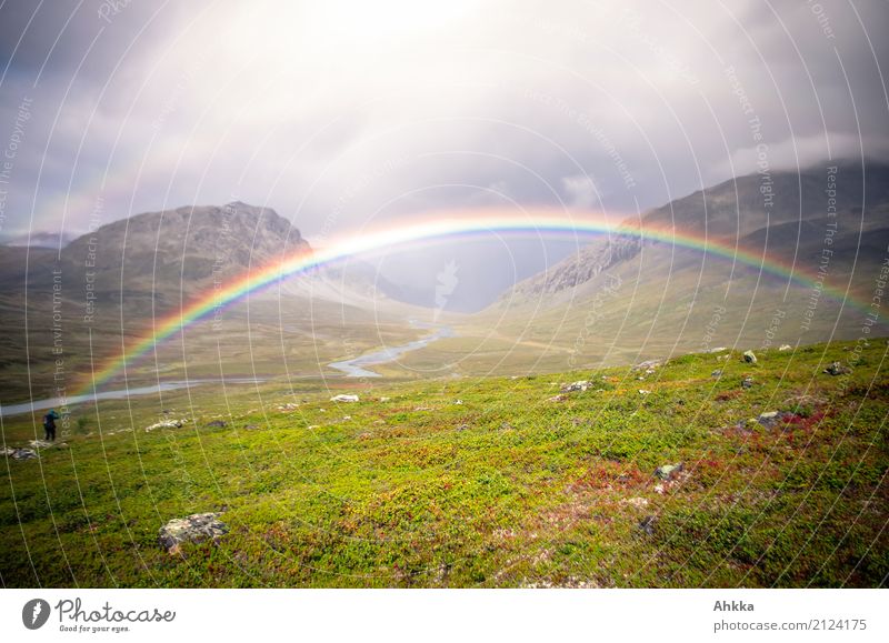 A man stands at the beginning of a whole rainbow that spans a valley Life 1 Human being Nature Landscape Elements Bad weather Rain Mountain Swede Rainbow