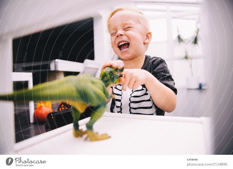 Little boy playing with dinosaur toys Joy Happy Leisure and hobbies Playing Child Boy (child) Toys Smiling Laughter Scream Funny Dinosaur little boy Offspring