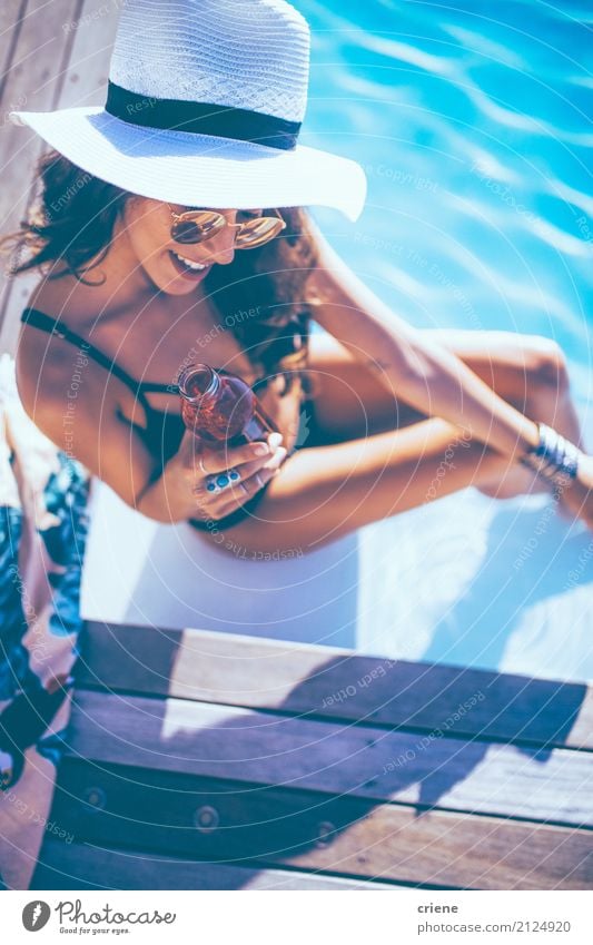 Beautiful young woman enjoying drink at the swimming pool Beverage Drinking Bottle Lifestyle Joy Happy Wellness Swimming pool Vacation & Travel Summer