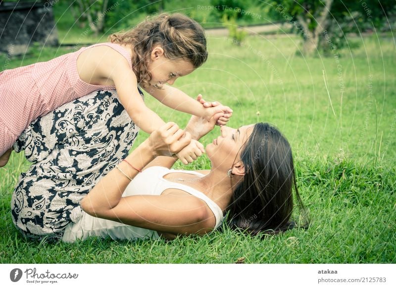 Happy mother and daughter playing in the park Lifestyle Joy Beautiful Face Leisure and hobbies Playing Vacation & Travel Summer Child Human being Baby Woman