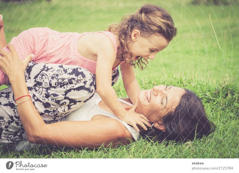 Happy mother and daughter playing in the park Lifestyle Joy Beautiful Face Leisure and hobbies Playing Summer Child Human being Baby Woman Adults Parents Mother