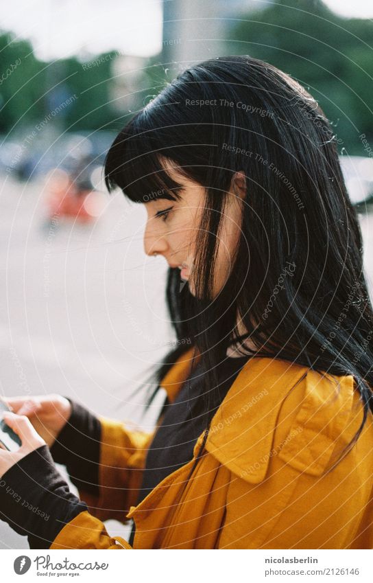 Portrait young woman with black hair tapping on cell phone Leisure and hobbies Vacation & Travel Tourism University & College student Telecommunications