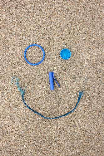 Plastic beach finds as a laughing face Sand Beach Laughter Make Playing Cool (slang) Happiness Broken Blue Virtuous Responsibility Joy Environment