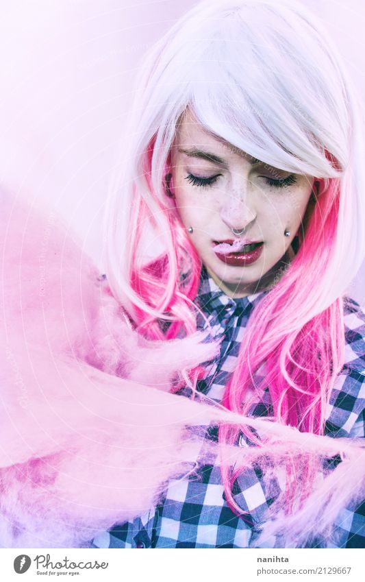 Young alternative woman is eating a cotton candy - a Royalty Free Stock  Photo from Photocase