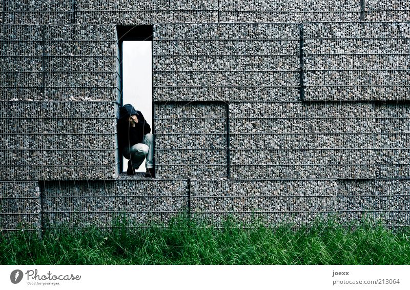 THE OTHER SIDE Man Adults 1 Human being Meadow Wall (barrier) Wall (building) Think Sadness Cry Sharp-edged Gloomy Gray Green Emotions Protection Grief Pain