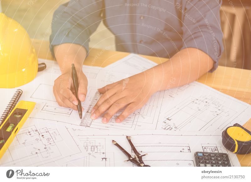 Architect or planner working on drawings for construction Design Desk Work and employment Profession Office Business Meeting Computer Notebook Technology