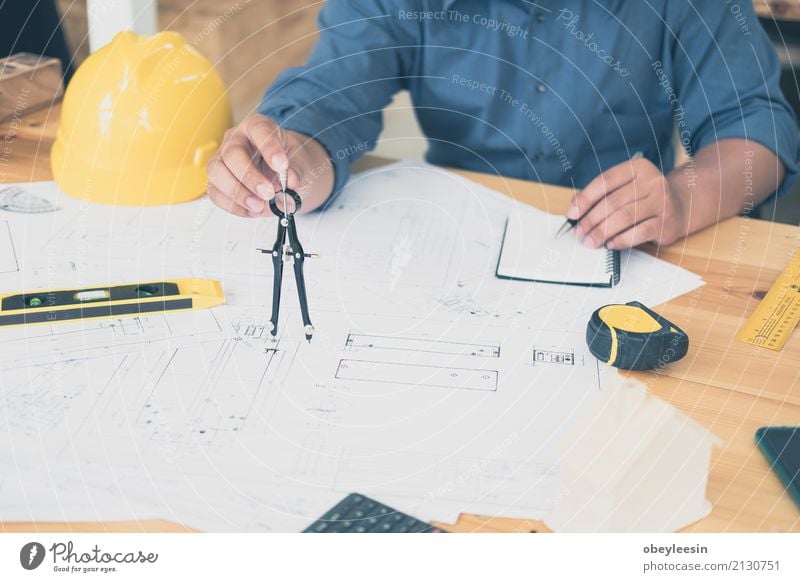 Architect or planner working on drawings for construction Design Desk Work and employment Profession Office Business Meeting Computer Notebook Technology