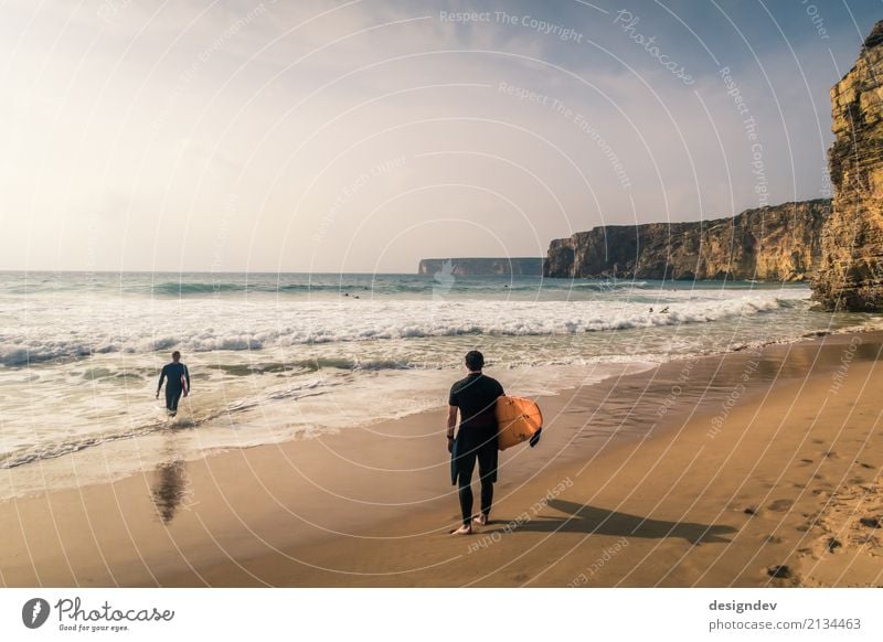 Two surfers on a beach in Portugal Lifestyle Athletic Swimming & Bathing Vacation & Travel Freedom Sun Beach Ocean Waves Surf school Surfing Surfboard Aquatics