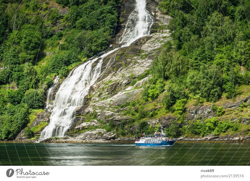View of the Geirangerfjord in Norway Vacation & Travel Tourism Cruise Mountain Nature Landscape Water Clouds Tree Forest Rock Fjord Waterfall Tourist Attraction
