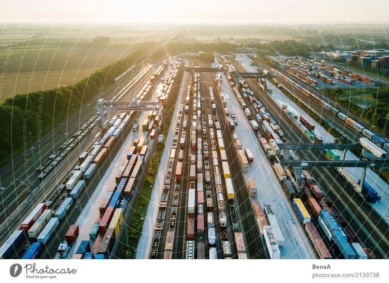 Freight trains and freight containers in a container terminal Economy Industry Trade Logistics Business Technology Advancement Future Transport