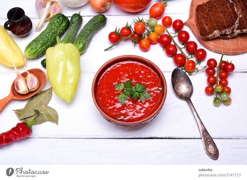 Soup gazpacho in a brown ceramic plate Vegetable Bread Stew Herbs and spices Nutrition Lunch Dinner Vegetarian diet Diet Plate Spoon Summer Table Kitchen Wood